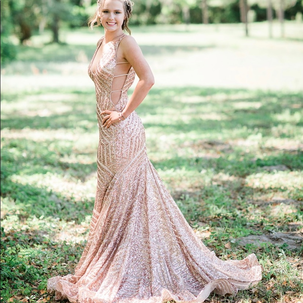 I am selling my senior prom dress. It is a size 4, rose gold Jovani dress!